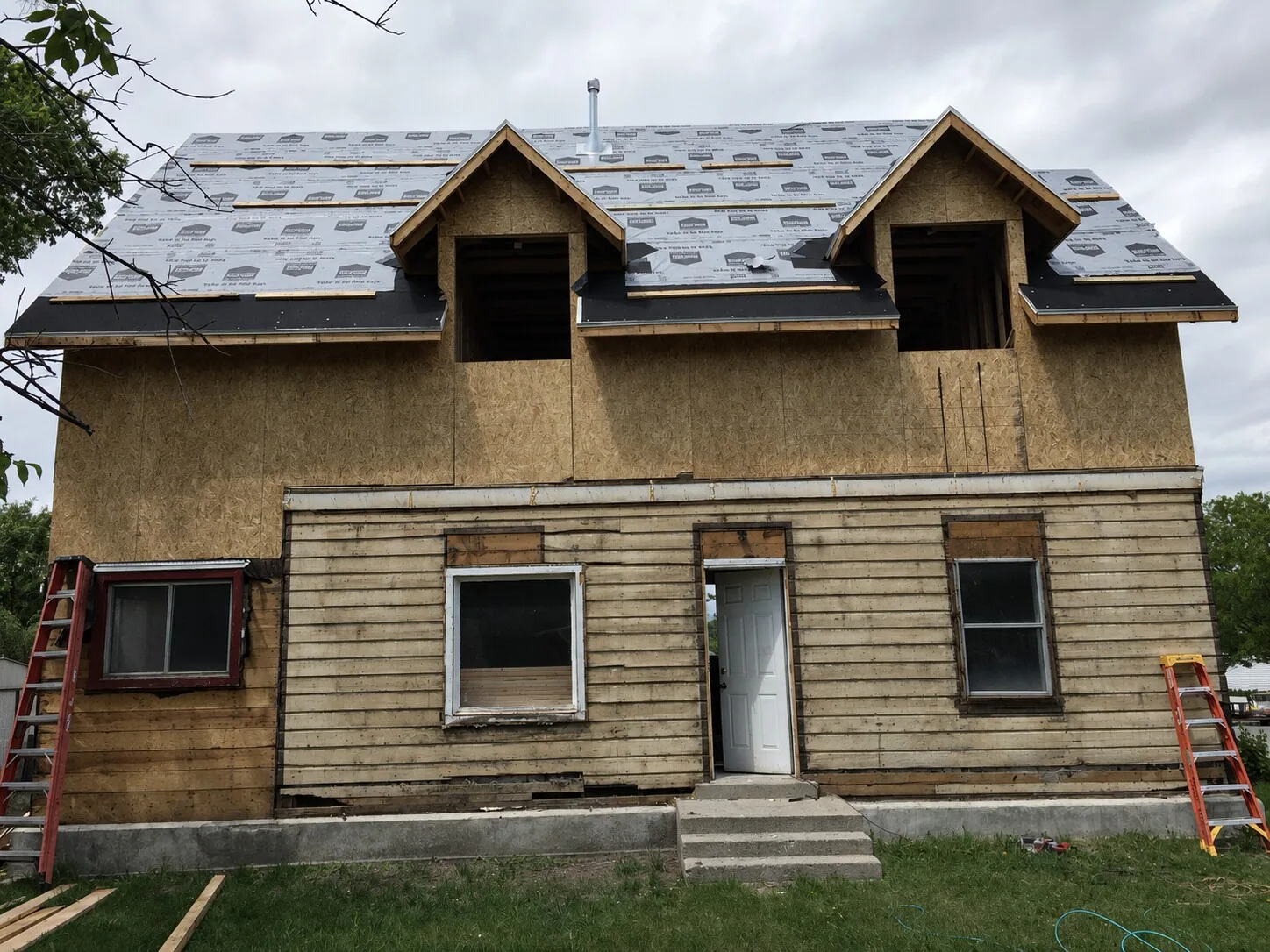 Existing lower level and newly framed upper level during the Lighthouse Remodel
